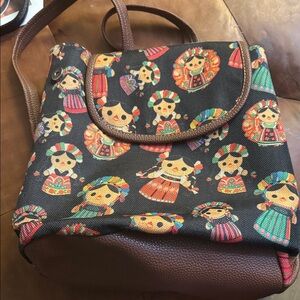 Black Patterned Women’s Backpack with Colorful Folk Doll Print